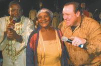 Pastor Rodney Howard-Browne receiving a testimony from a lady giving a testimony in the Mamelodi, South Africa, Crusade